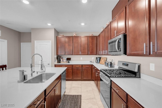 946 Belton Lake Ave, North Las Vegas, NV 89086 - kitchen with appliances with stainless steel finishes, a sink, light tile patterned floors, light countertops, and recessed lighting