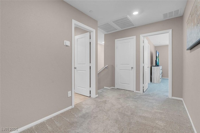 946 Belton Lake Ave, North Las Vegas, NV 89086 - hallway with visible vents, carpet flooring, baseboards, and an upstairs landing
