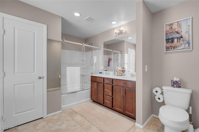 946 Belton Lake Ave, North Las Vegas, NV 89086 - bathroom with double vanity, visible vents, a sink, tile patterned floors, and toilet