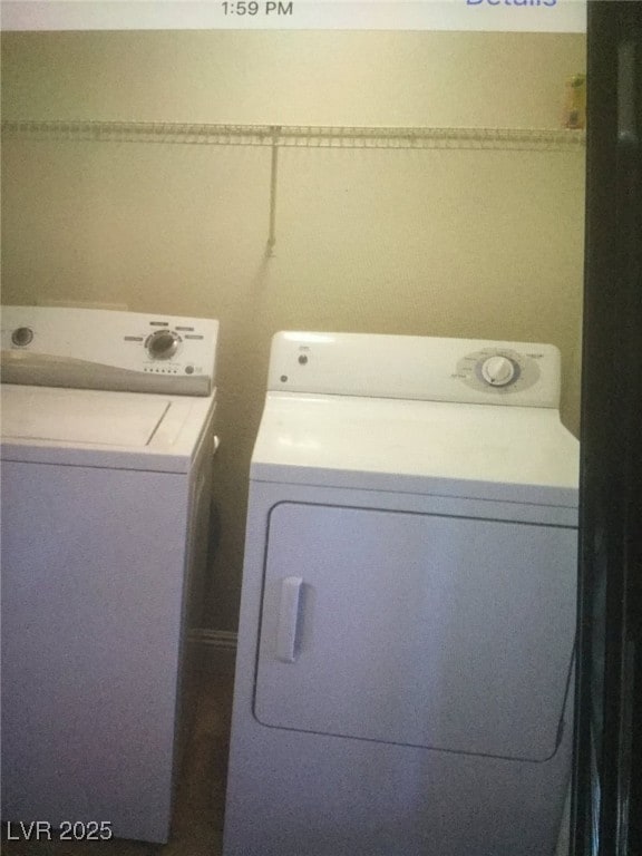 laundry area featuring separate washer and dryer and laundry area