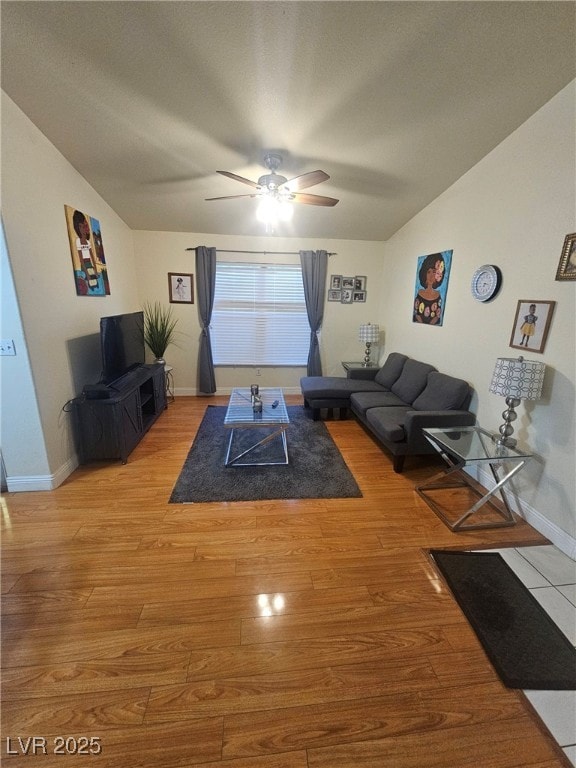 555 E Silverado Ranch Blvd Unit 2028, Las Vegas, NV 89183 - living area featuring a ceiling fan, vaulted ceiling, light wood-type flooring, and baseboards