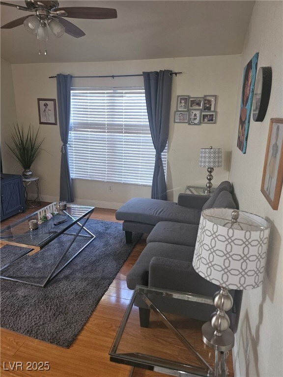 555 E Silverado Ranch Blvd Unit 2028, Las Vegas, NV 89183 - living area featuring wood finished floors, a ceiling fan, and baseboards