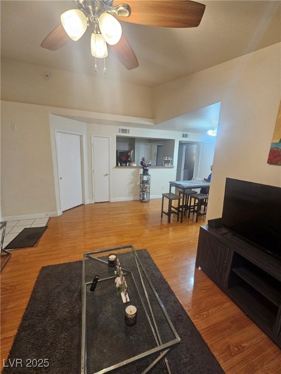 555 E Silverado Ranch Blvd Unit 2028, Las Vegas, NV 89183 - living area featuring ceiling fan, wood finished floors, and baseboards