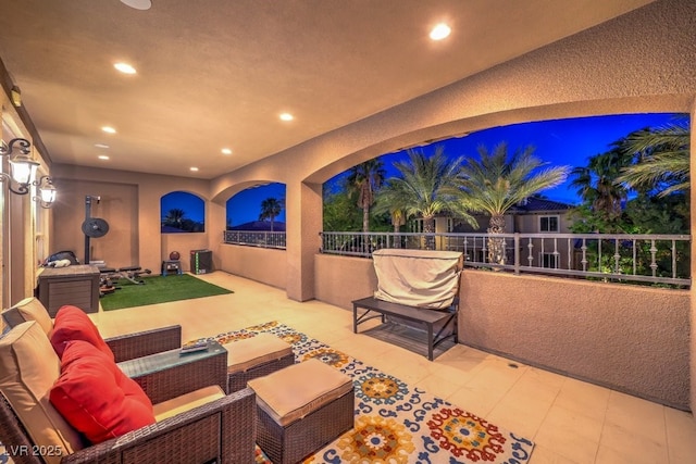 view of patio with outdoor lounge area and a balcony