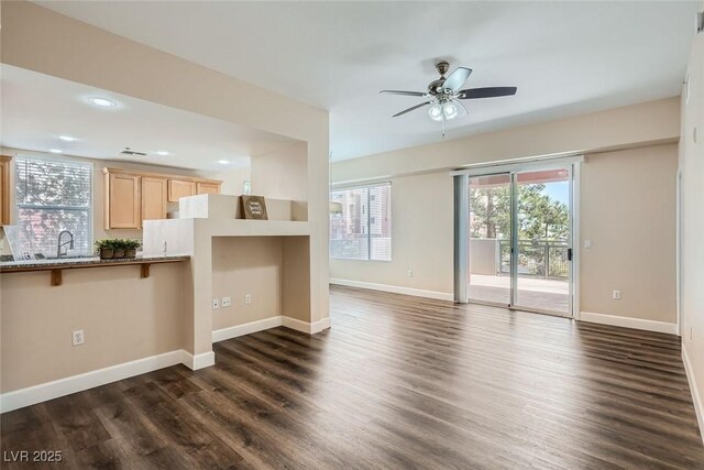 55 E Agate Ave Unit 202, Las Vegas, NV 89123 - unfurnished living room featuring a sink, baseboards, dark wood-type flooring, recessed lighting, and a ceiling fan