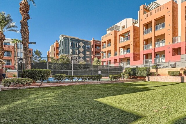55 E Agate Ave Unit 202, Las Vegas, NV 89123 - view of community with a lawn and fence
