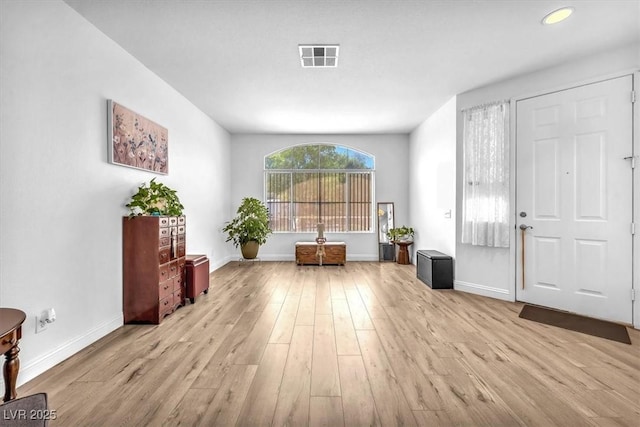 foyer entrance featuring recessed lighting, baseboards, visible vents, and light wood-style floors
