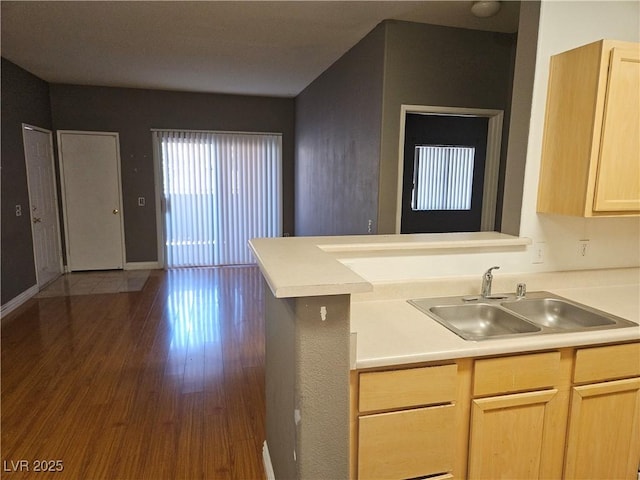 2615 W Gary Ave Unit 1085, Las Vegas, NV 89123 - kitchen with light brown cabinets, light countertops, dark wood-style flooring, and a peninsula