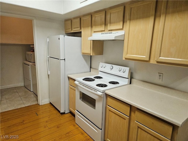 2615 W Gary Ave Unit 1085, Las Vegas, NV 89123 - kitchen with white appliances, under cabinet range hood, light countertops, and washing machine and clothes dryer