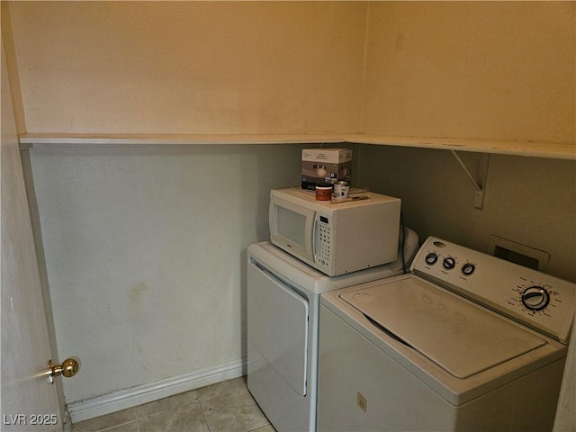 2615 W Gary Ave Unit 1085, Las Vegas, NV 89123 - laundry room featuring washing machine and clothes dryer and light tile patterned floors