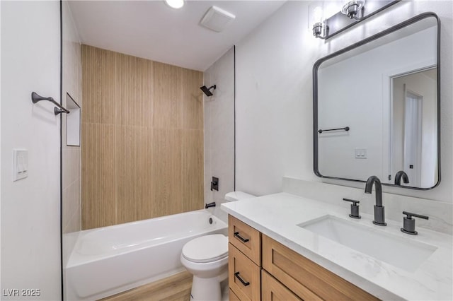 bathroom with vanity, shower / tub combination, visible vents, and toilet