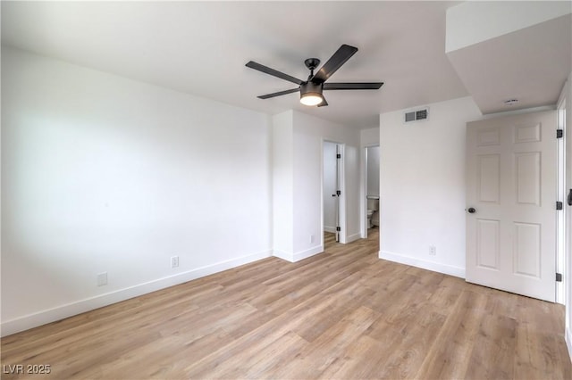 unfurnished bedroom featuring a ceiling fan, baseboards, visible vents, and light wood-type flooring