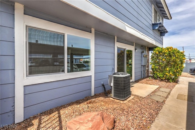 view of side of home featuring cooling unit