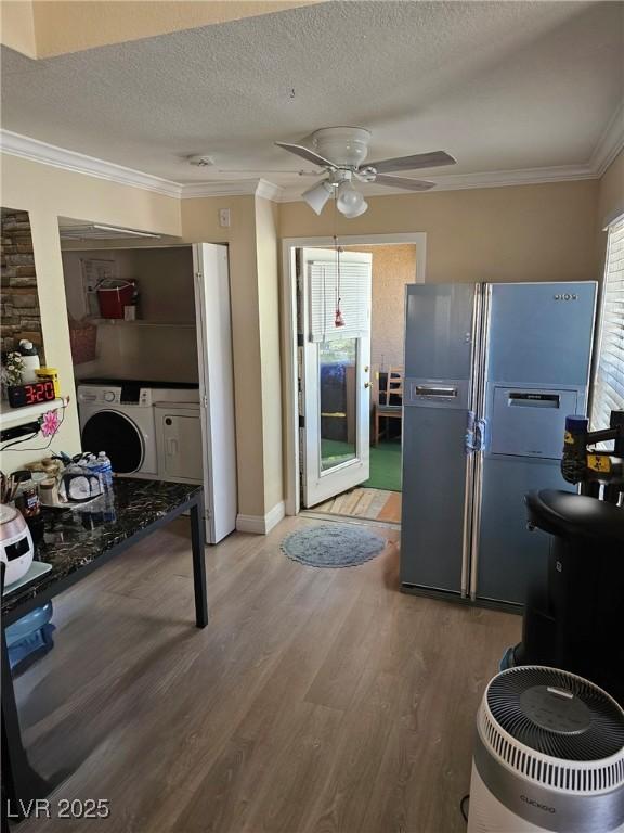 8101 W Flamingo Rd Unit 2078, Las Vegas, NV 89147 - kitchen featuring fridge with ice dispenser, healthy amount of natural light, crown molding, wood finished floors, and a ceiling fan