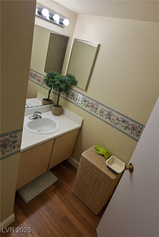 8101 W Flamingo Rd Unit 2078, Las Vegas, NV 89147 - bathroom with wood finished floors and vanity
