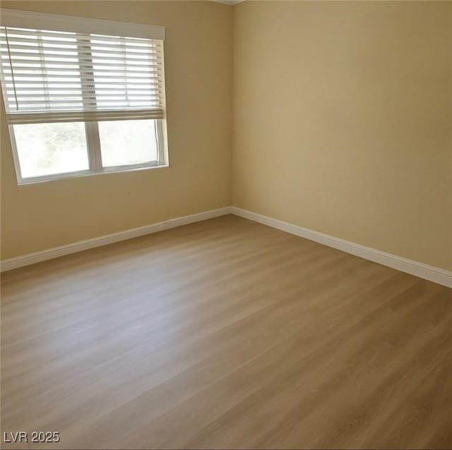8101 W Flamingo Rd Unit 2078, Las Vegas, NV 89147 - empty room featuring baseboards and light wood-style floors