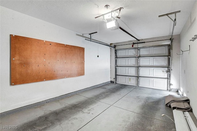 garage featuring baseboards and a garage door opener