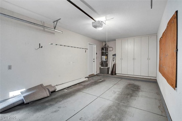 garage featuring a garage door opener and water heater