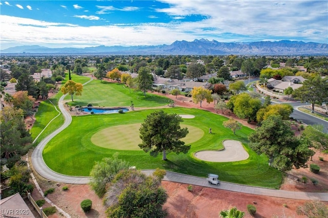 aerial view with a residential view, view of golf course, and a water and mountain view