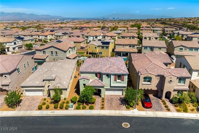 aerial view of residential area with a mountain backdrop