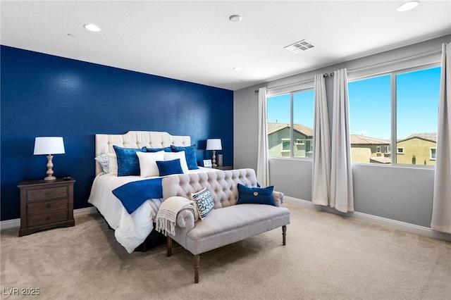 carpeted bedroom featuring an accent wall, recessed lighting, and baseboards