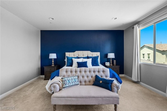 bedroom featuring carpet, baseboards, recessed lighting, and an accent wall