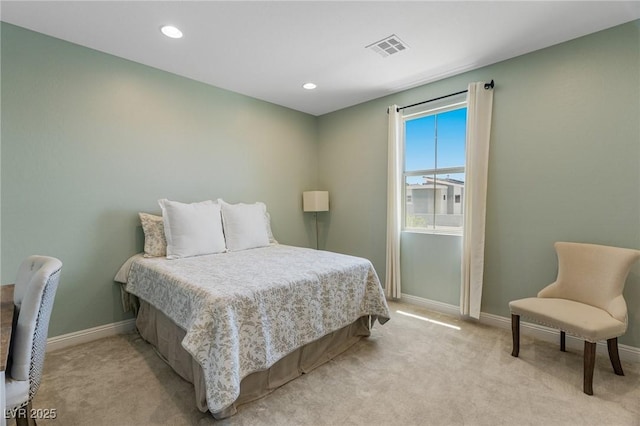 bedroom with baseboards, light carpet, and recessed lighting