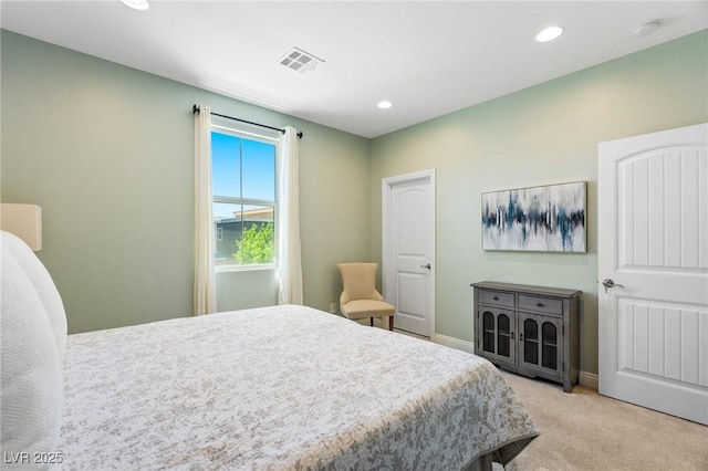 bedroom with light carpet, recessed lighting, and baseboards