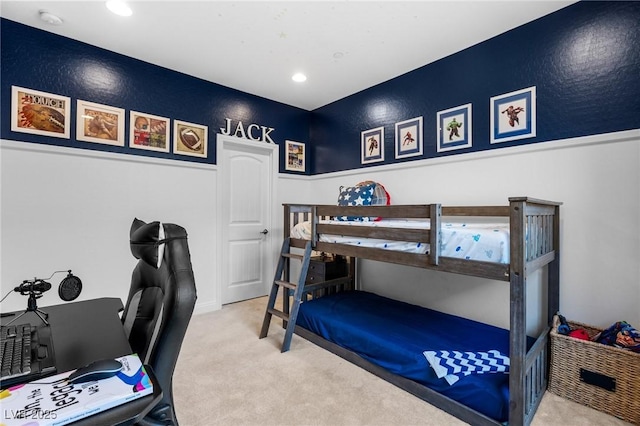 carpeted bedroom with a desk and recessed lighting