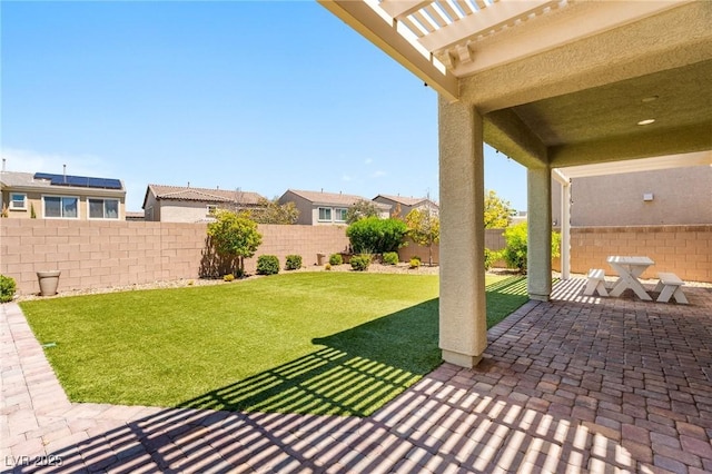 view of yard featuring a patio, a pergola, and a residential view