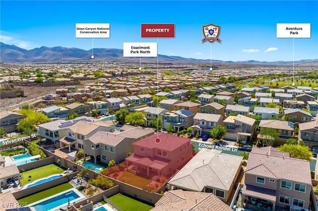 aerial view of residential area with a mountainous background