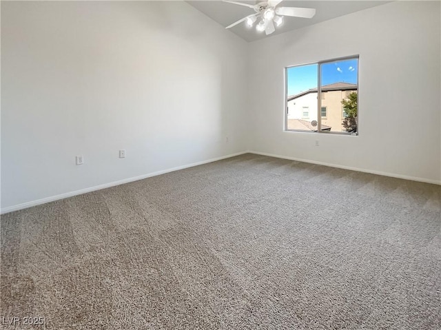 carpeted empty room featuring baseboards, ceiling fan, and lofted ceiling