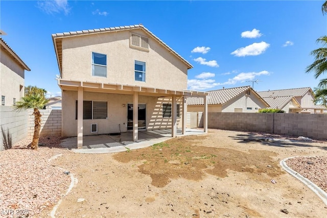 9013 Meisenheimer Ave, Las Vegas, NV 89143 - rear view of house featuring stucco siding, a fenced backyard, and a patio area