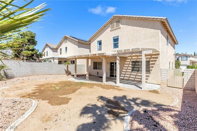 9013 Meisenheimer Ave, Las Vegas, NV 89143 - back of house featuring stucco siding, a pergola, a patio, and a fenced backyard