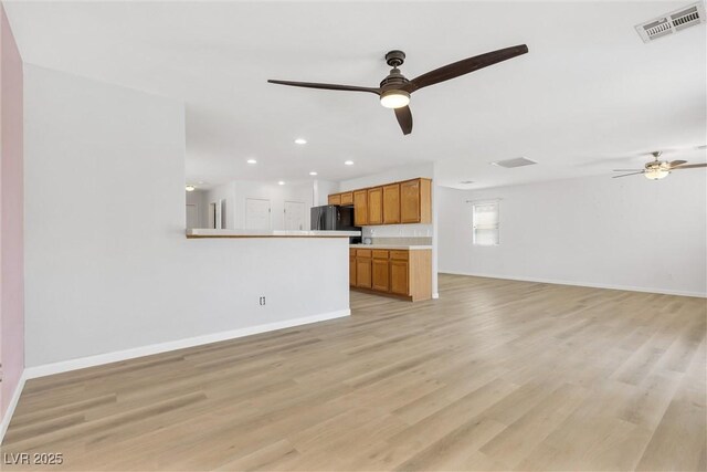 unfurnished living room with visible vents, recessed lighting, baseboards, and ceiling fan