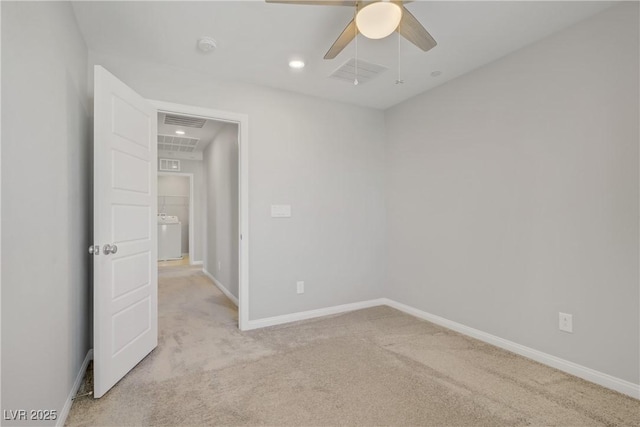 unfurnished room featuring baseboards, ceiling fan, light colored carpet, and visible vents