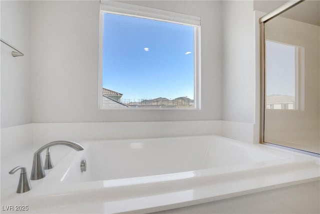 bathroom featuring a bath