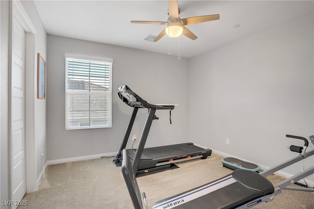 workout area featuring baseboards, visible vents, light carpet, and ceiling fan