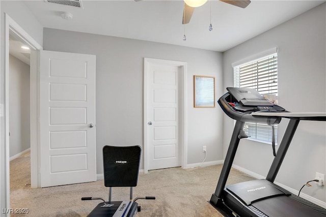 exercise room with carpet floors, a ceiling fan, baseboards, and visible vents
