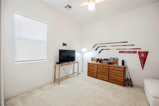 carpeted bedroom featuring baseboards, visible vents, and ceiling fan