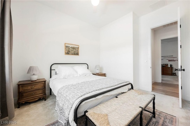 bedroom with light carpet