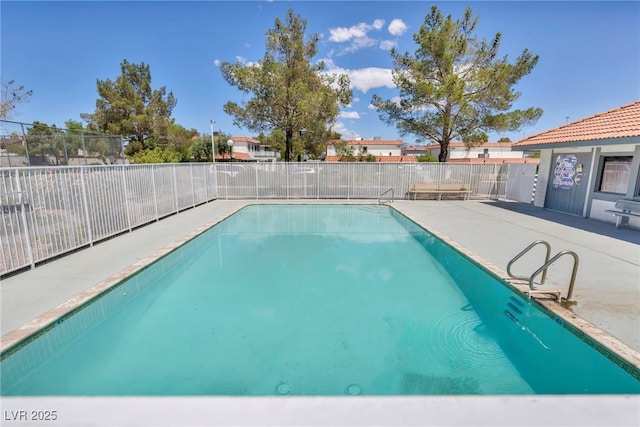 community pool featuring fence