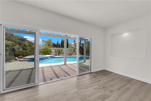 interior space with a pool with connected hot tub