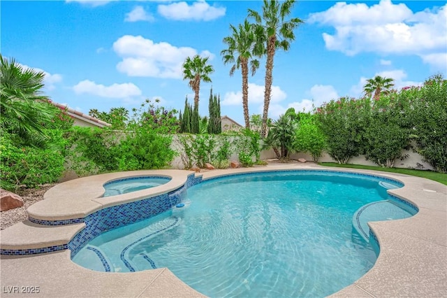 view of swimming pool featuring a fenced backyard and a pool with connected hot tub
