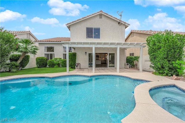 back of property featuring a pergola, stucco siding, an outdoor pool, a patio area, and a tiled roof