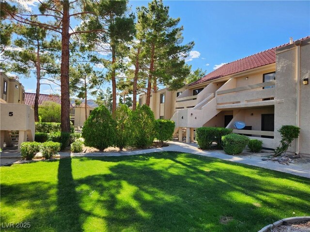 surrounding community with a lawn