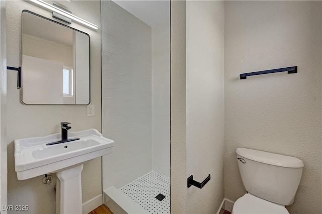 full bathroom with a shower stall and toilet
