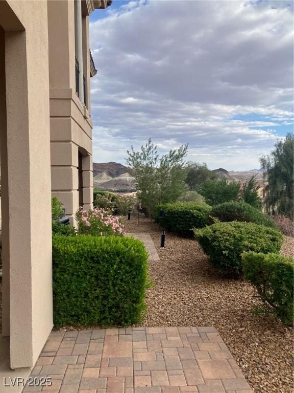 32 Via Vasari Unit 103, Henderson, NV 89011 - view of yard with a mountain view