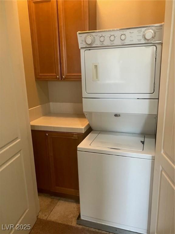 32 Via Vasari Unit 103, Henderson, NV 89011 - washroom with stacked washer and dryer