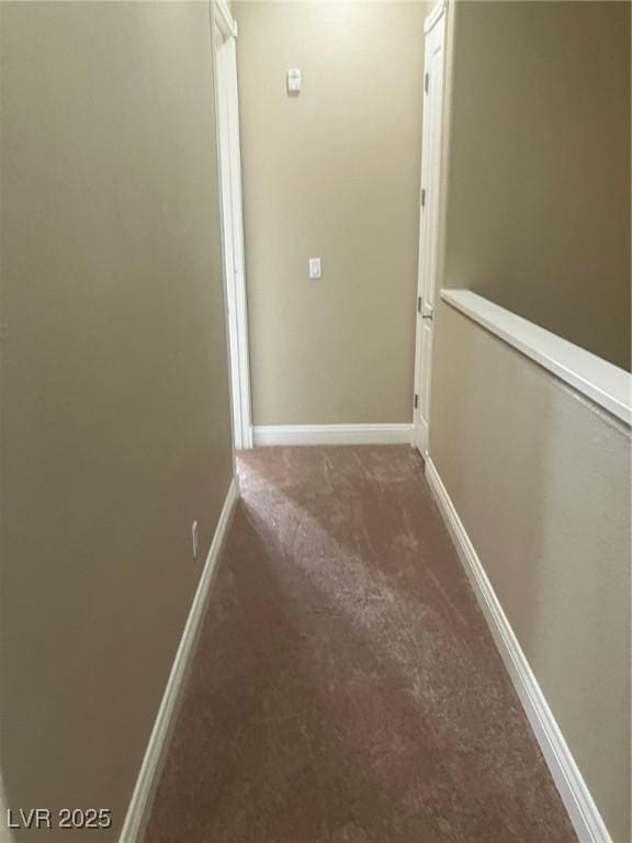 32 Via Vasari Unit 103, Henderson, NV 89011 - hallway with carpet and baseboards
